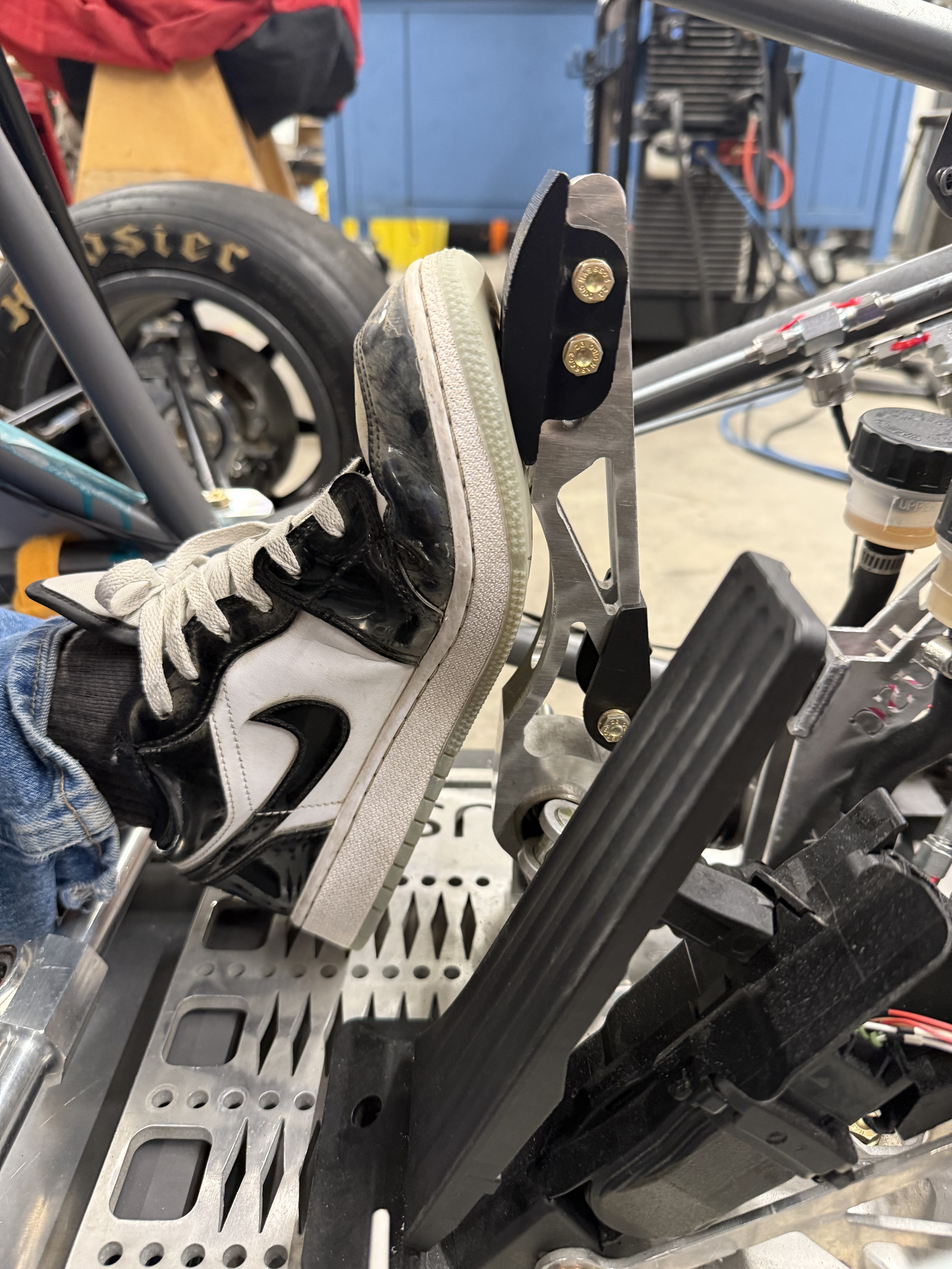 Driver foot on brake pedal — ergonomics fit check in car
